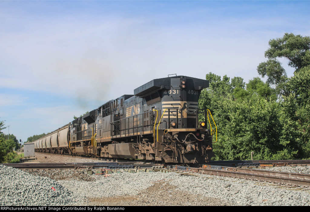 NS 4031 running LHF leads a grain train across the CSX main on the old Wabash 